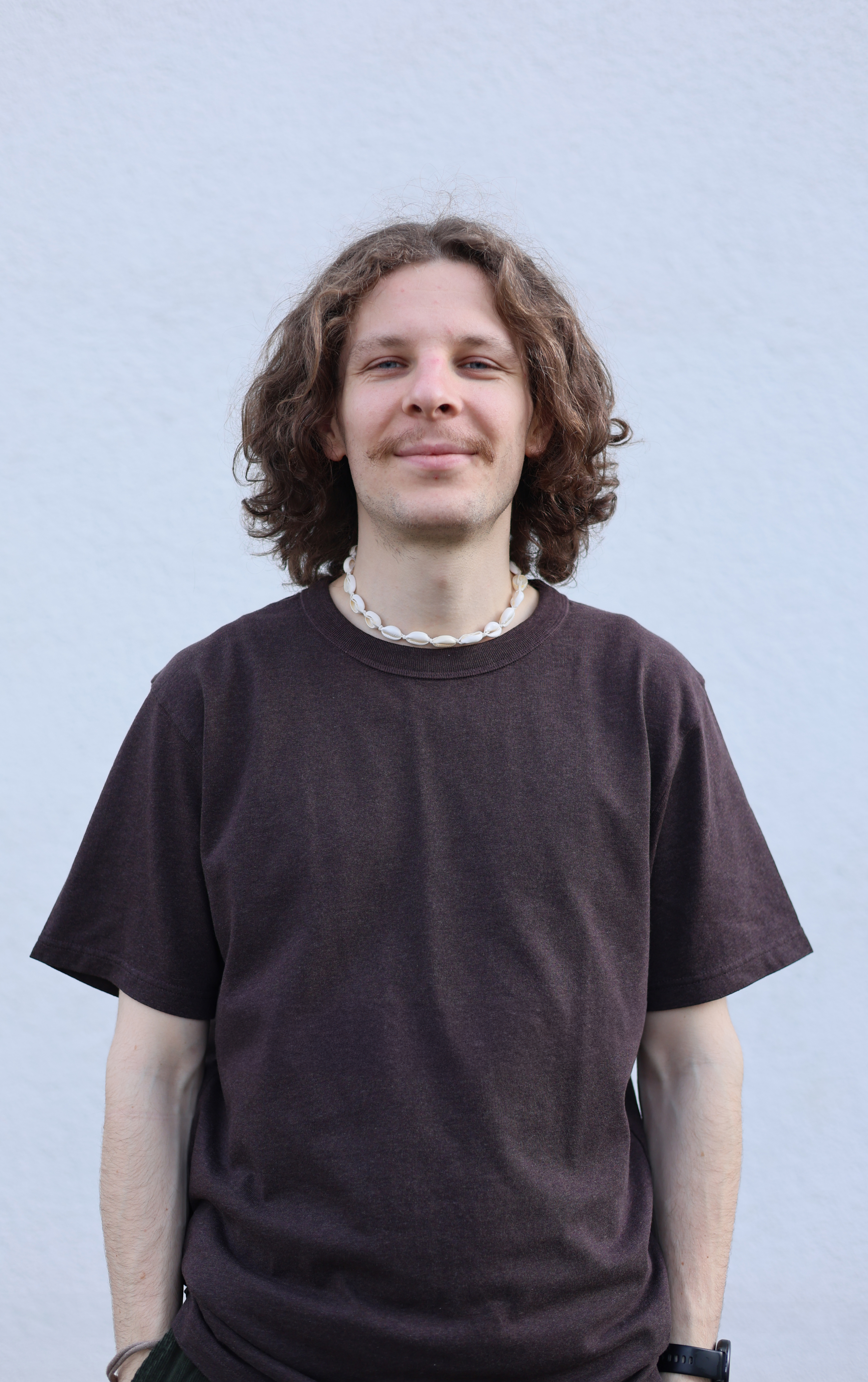 A image of a concrete sphere, balanced between two other larger spheres